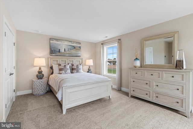 bedroom featuring light colored carpet