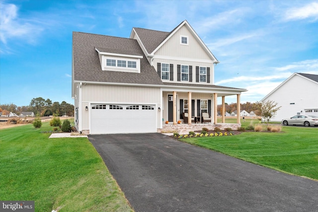 craftsman-style house featuring a front yard, a porch, and a garage