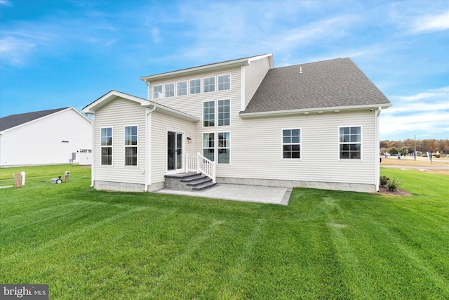 rear view of property with a patio area and a yard