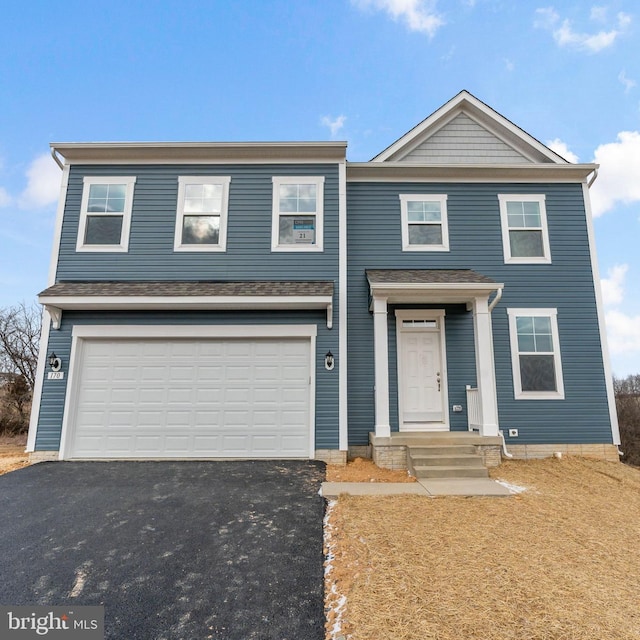 view of front of house with driveway and an attached garage