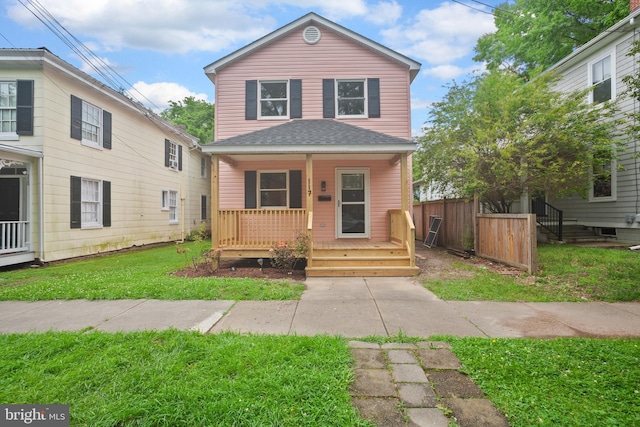 front of property featuring a front lawn and a porch