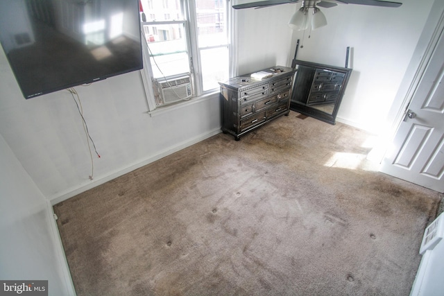 unfurnished bedroom with light colored carpet, cooling unit, and ceiling fan