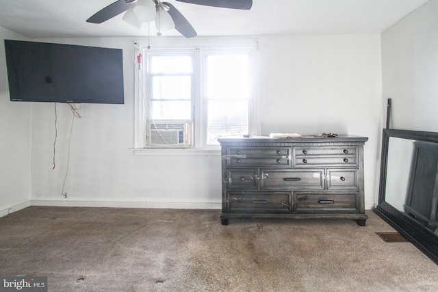 bedroom with cooling unit, ceiling fan, and carpet