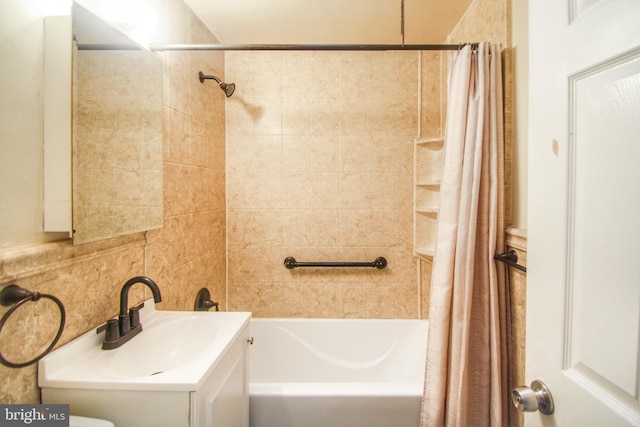 bathroom featuring shower / bath combination with curtain and vanity