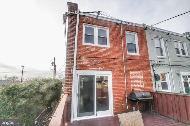 rear view of house with a deck