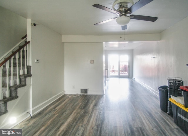 empty room featuring ceiling fan and dark hardwood / wood-style floors