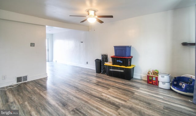 interior space with dark hardwood / wood-style floors and ceiling fan