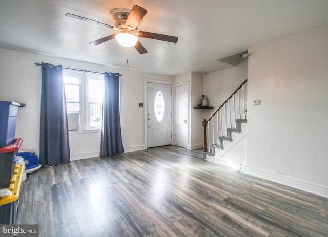 entryway with ceiling fan and dark hardwood / wood-style flooring