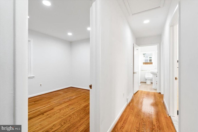 hall with light hardwood / wood-style floors