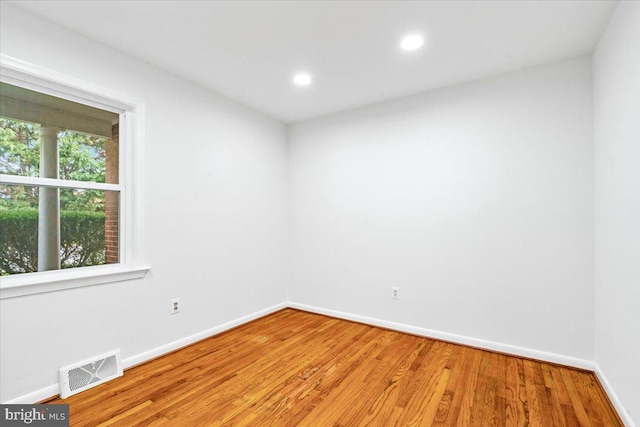 spare room featuring light hardwood / wood-style flooring