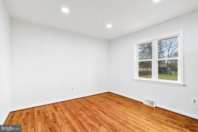 empty room featuring light hardwood / wood-style floors