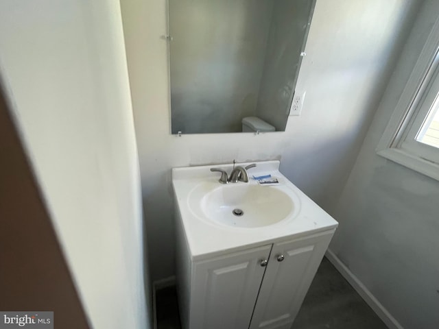 bathroom with vanity and toilet