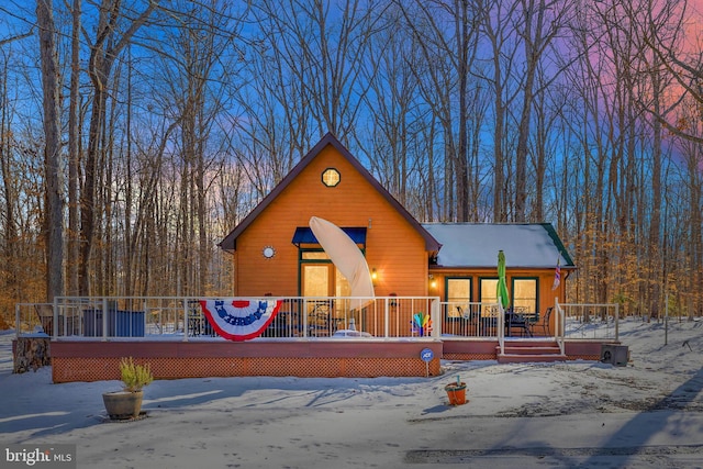 view of front of house featuring a wooden deck