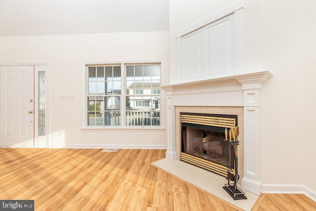 unfurnished living room featuring wood-type flooring