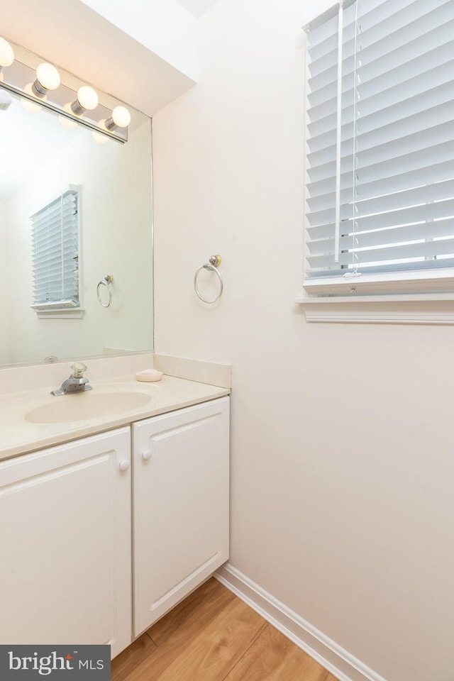 bathroom featuring vanity and wood-type flooring