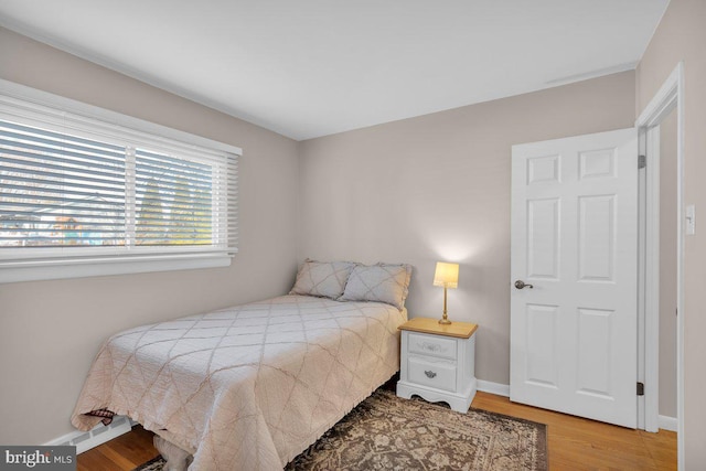 bedroom with hardwood / wood-style floors