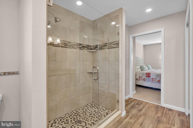 bathroom with a shower with shower door