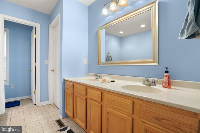 bathroom featuring tile patterned flooring and vanity