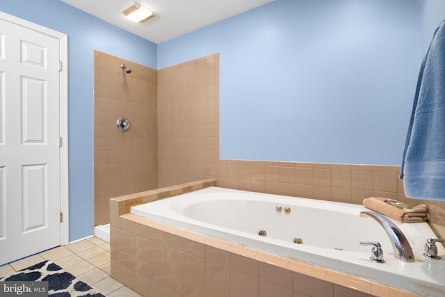 bathroom featuring tile patterned floors and independent shower and bath