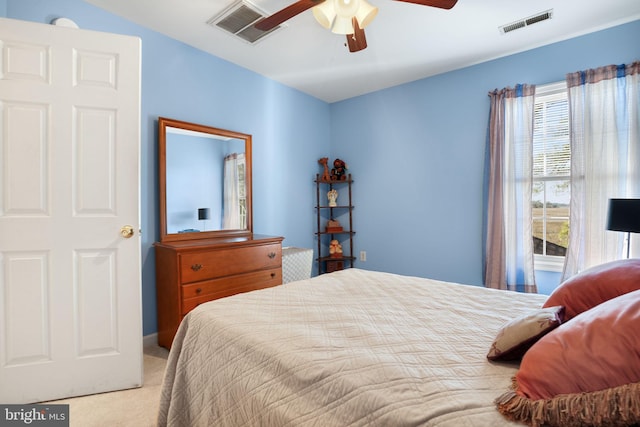 bedroom featuring ceiling fan and light carpet