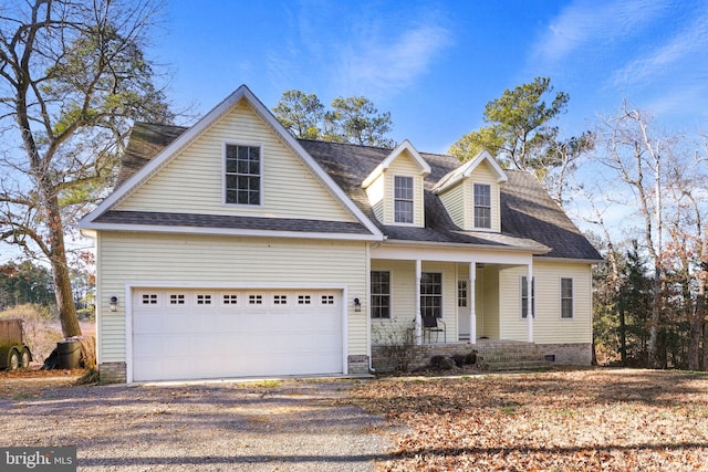 view of front facade with a porch and a garage