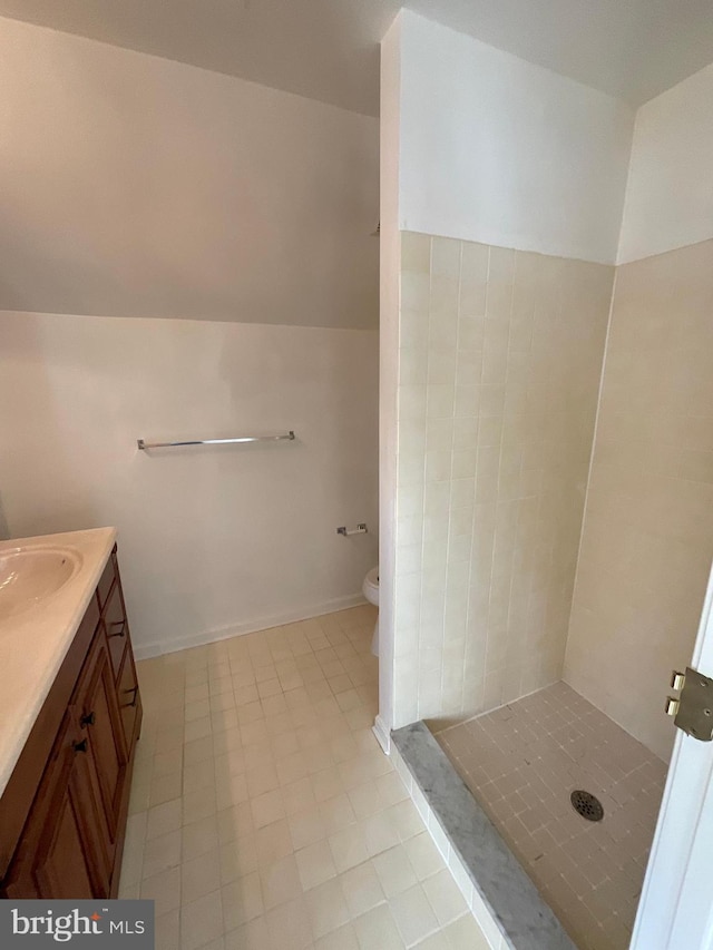 bathroom featuring tile patterned floors, vanity, and toilet