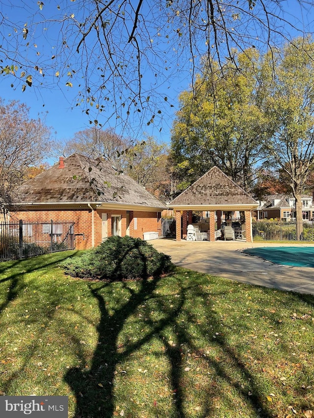 exterior space with a gazebo and a yard