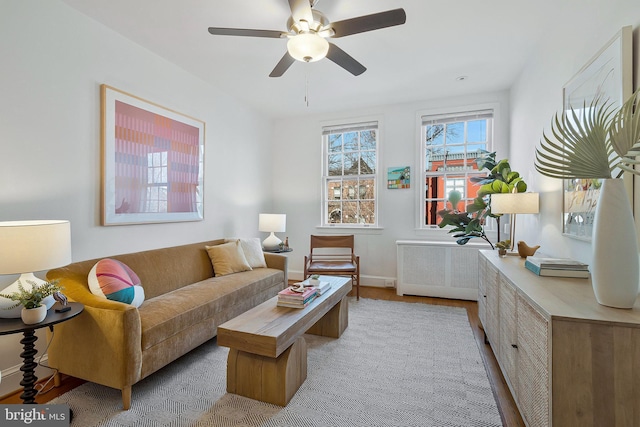 living room with radiator heating unit and ceiling fan