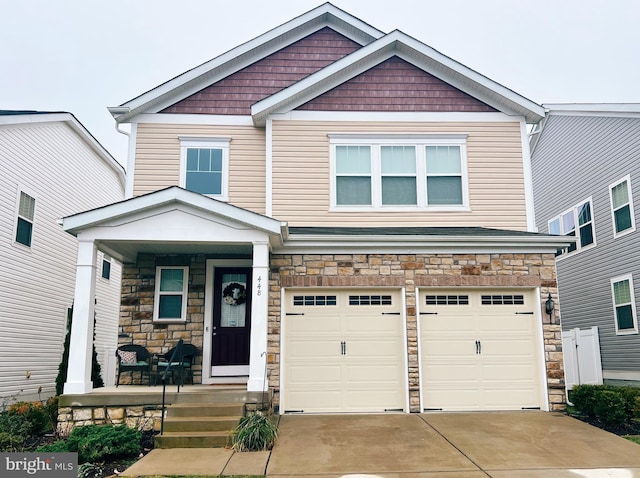 craftsman-style house featuring a garage and covered porch