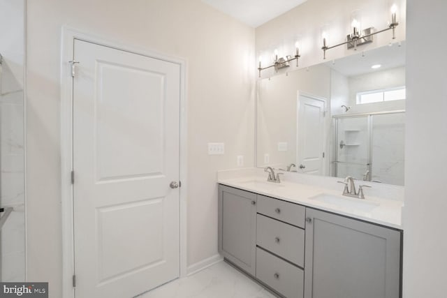 bathroom featuring vanity and a shower with door