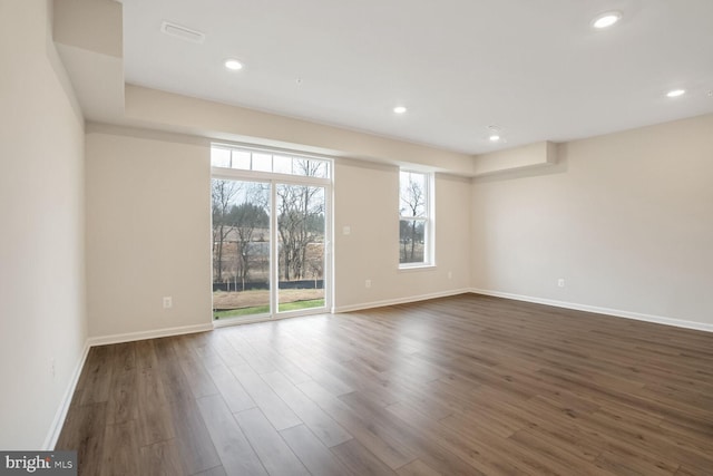 unfurnished room featuring dark wood-type flooring