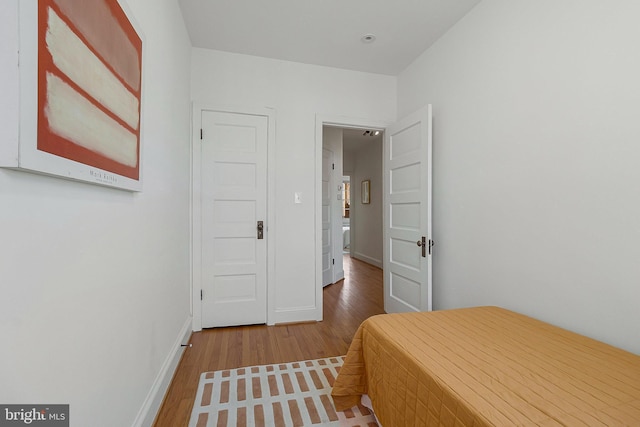 bedroom featuring wood-type flooring