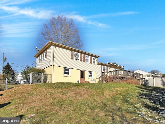 exterior space with a lawn and a wooden deck