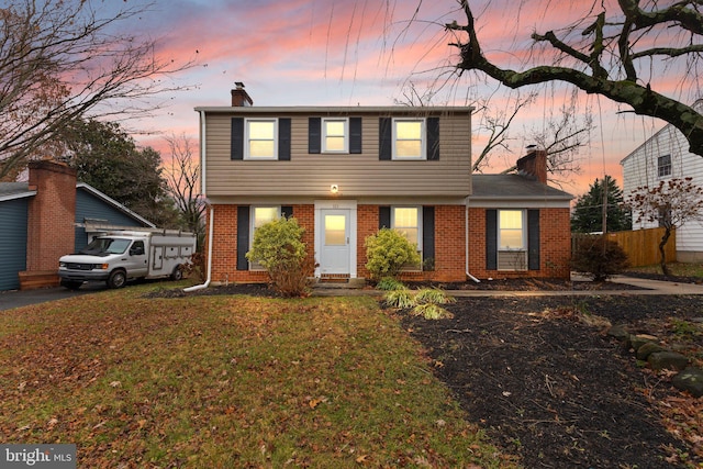 view of front property with a lawn