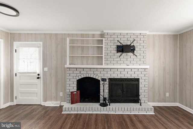 unfurnished living room featuring dark hardwood / wood-style floors, a brick fireplace, and ornamental molding