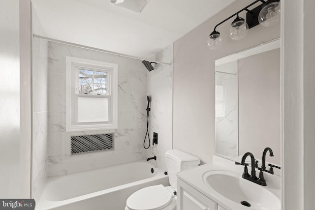 full bathroom with vanity, toilet, and tiled shower / bath combo