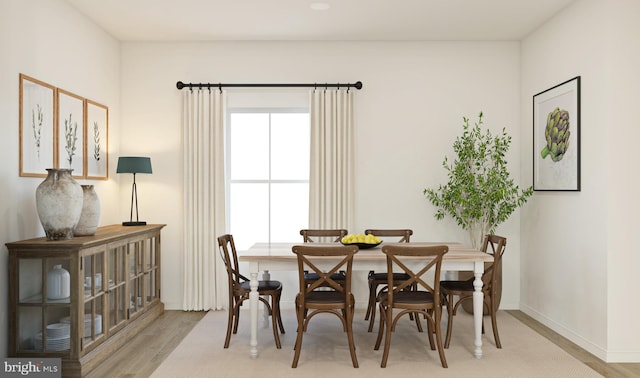 dining space featuring light hardwood / wood-style flooring