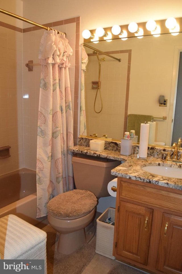 full bathroom with vanity, shower / bath combination with curtain, and toilet