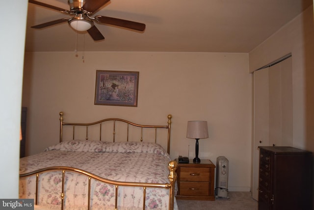 bedroom featuring carpet flooring, ceiling fan, and a closet