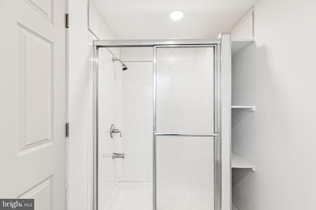 bathroom with an enclosed shower