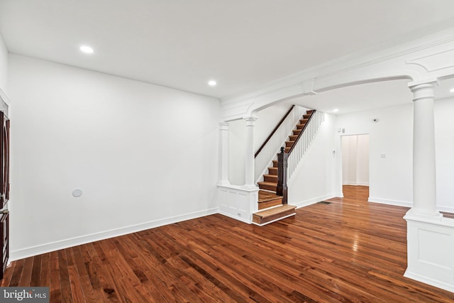 unfurnished living room featuring dark wood-type flooring