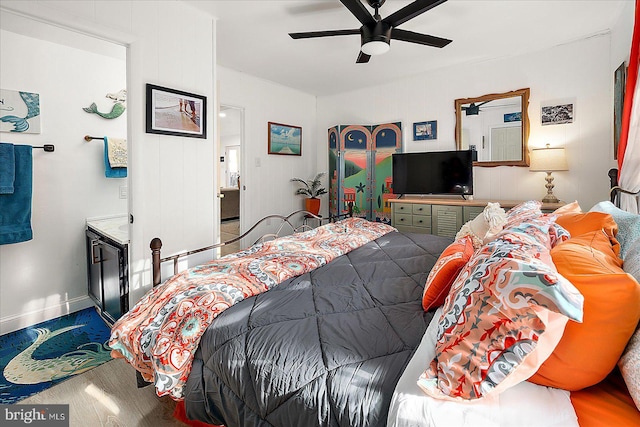 bedroom featuring hardwood / wood-style flooring and ceiling fan