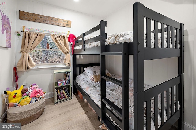 bedroom with wood-type flooring