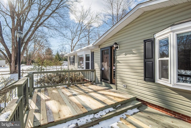 view of snow covered deck