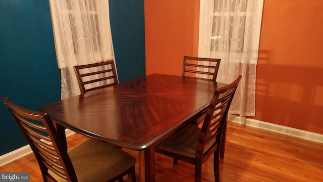 dining room with hardwood / wood-style flooring