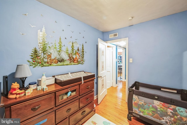 bedroom with light hardwood / wood-style floors