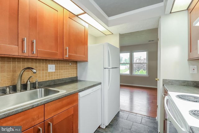 408 Berkshire Ct, Joppa, MD 21085 - kitchen featuring dishwasher, tasteful backsplash, range, brown cabinetry, and dark stone finish floors