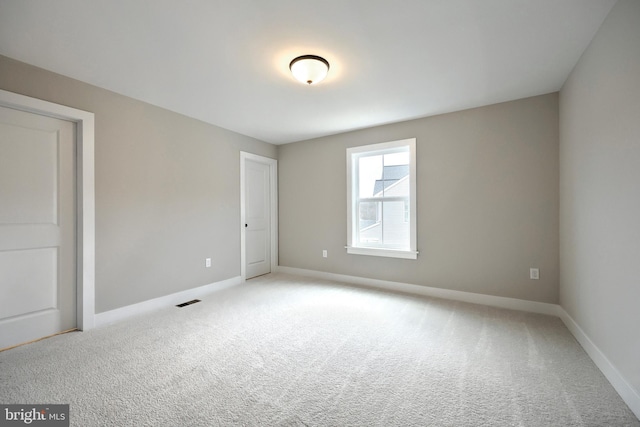 view of carpeted spare room