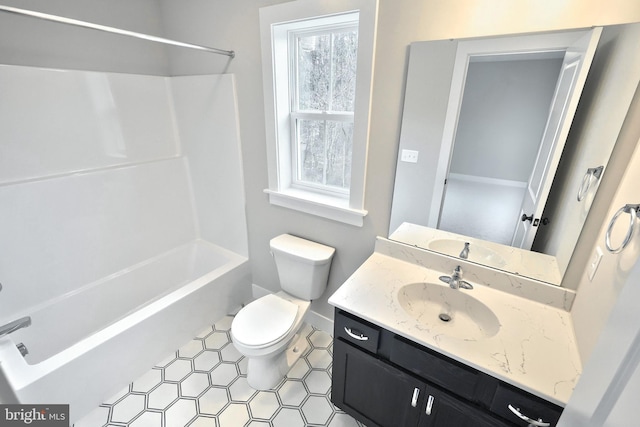 full bathroom with shower / tub combination, vanity, a healthy amount of sunlight, and toilet