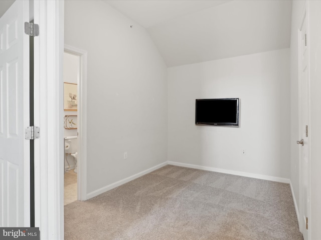 bonus room featuring light carpet and lofted ceiling